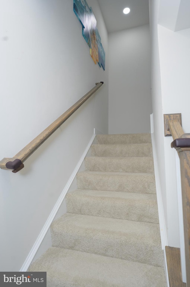 staircase with baseboards and recessed lighting