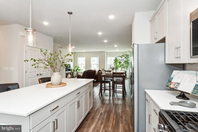 kitchen featuring white cabinetry, light countertops, dark wood finished floors, and recessed lighting