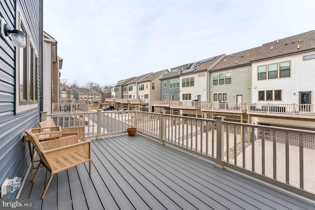 wooden deck featuring a residential view