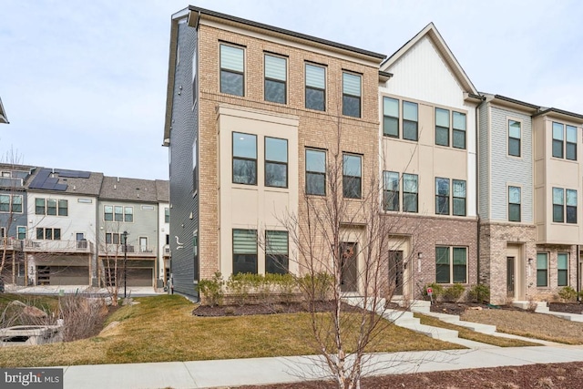 multi unit property featuring brick siding