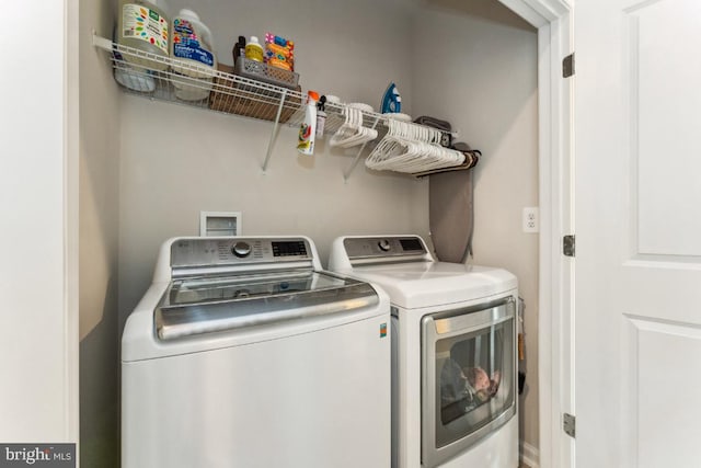 laundry area with laundry area and separate washer and dryer