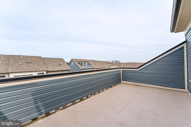 view of patio featuring a balcony