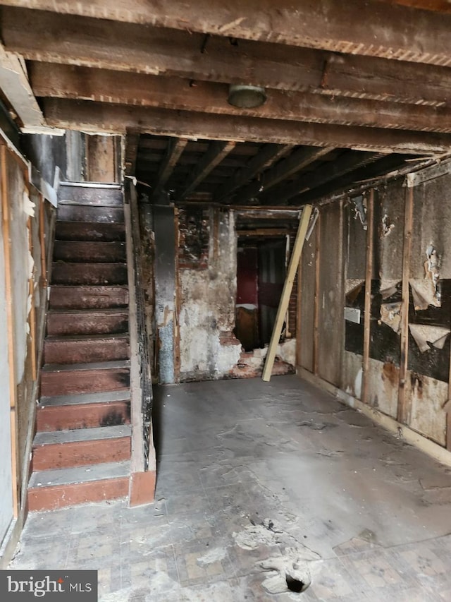 unfinished basement with stairway