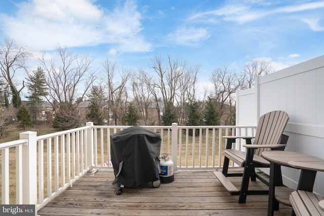 wooden terrace with area for grilling