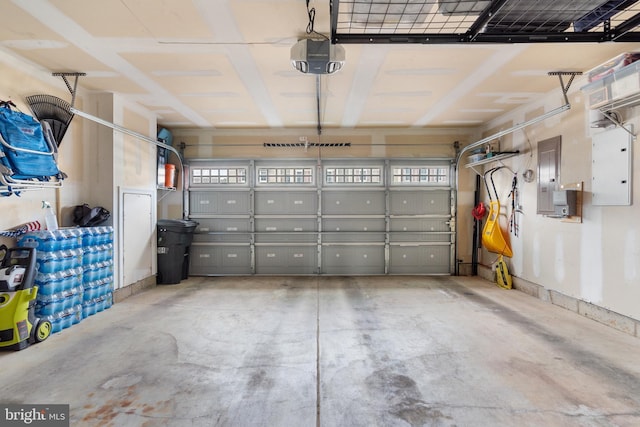 garage featuring a garage door opener and electric panel