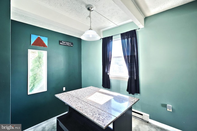 office space with a baseboard heating unit, a textured ceiling, and baseboards