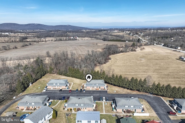 birds eye view of property with a mountain view