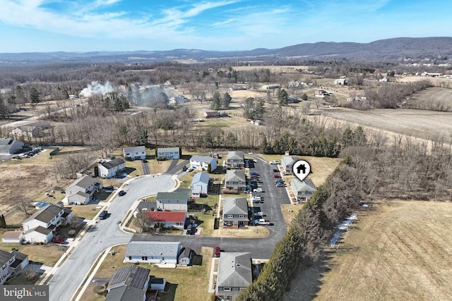 drone / aerial view with a residential view and a mountain view