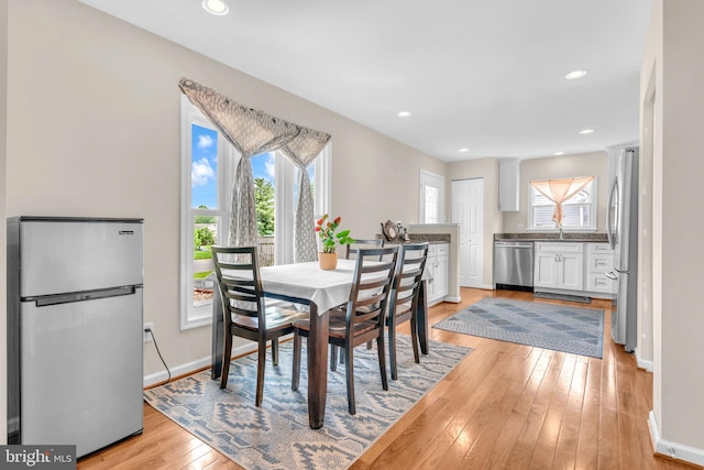603 N York Rd, Sterling, VA 20164 - dining area featuring healthy amount of natural light, light wood finished floors, baseboards, recessed lighting, and ornate columns