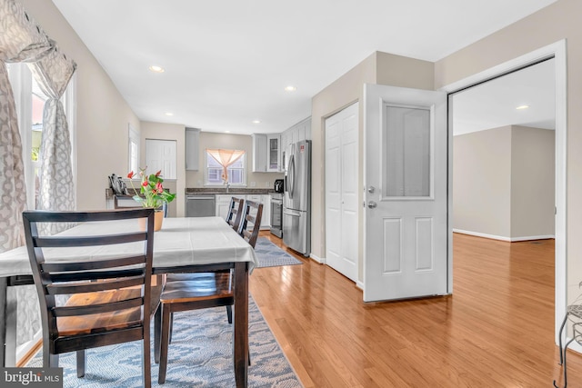 603 N York Rd, Sterling, VA 20164 - dining area with light wood-type flooring, recessed lighting, and baseboards
