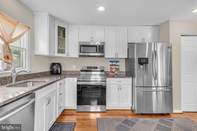 603 N York Rd, Sterling, VA 20164 - kitchen featuring stainless steel appliances, a sink, white cabinetry, stone countertops, and recessed lighting