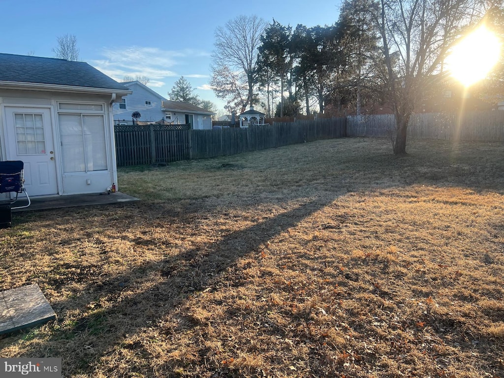 view of yard with a fenced backyard