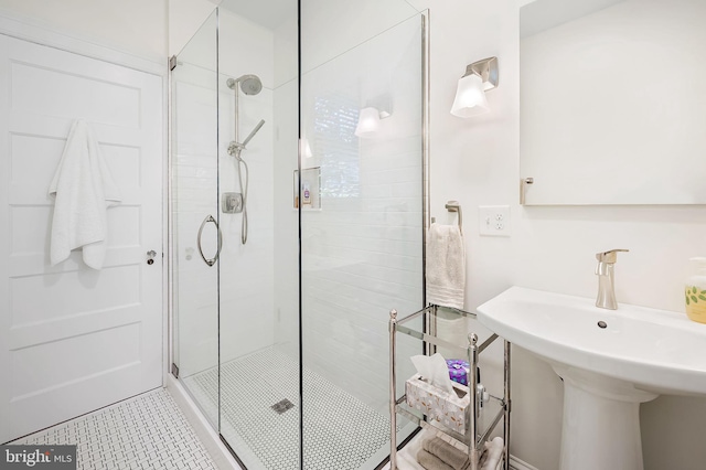 bathroom featuring a stall shower and tile patterned flooring