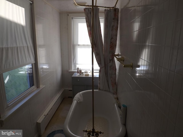 bathroom featuring a baseboard radiator and shower / bathtub combination with curtain