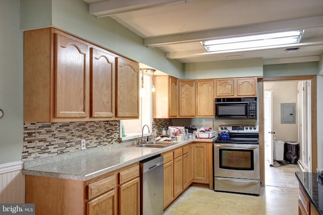 kitchen featuring tasteful backsplash, appliances with stainless steel finishes, a sink, light countertops, and beam ceiling