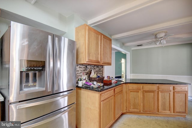 kitchen with stainless steel fridge, decorative backsplash, a ceiling fan, a peninsula, and beam ceiling