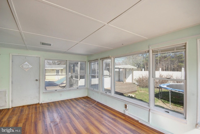 unfurnished sunroom featuring visible vents