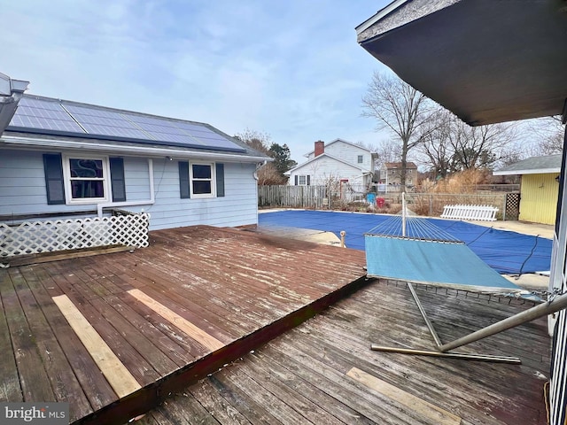 deck with fence and a fenced in pool