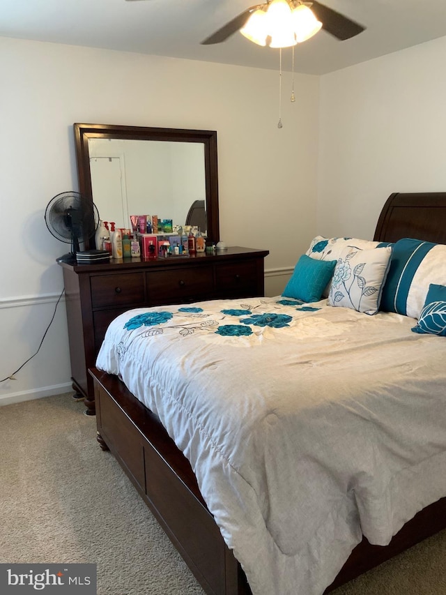 bedroom with baseboards, carpet, and a ceiling fan