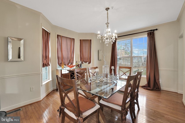 13110 Ogles Hope Dr, Bowie, MD 20720 - dining room with ornamental molding, a wealth of natural light, visible vents, and light wood finished floors