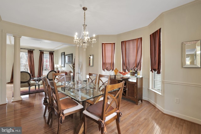 13110 Ogles Hope Dr, Bowie, MD 20720 - dining area with light wood-type flooring, decorative columns, baseboards, and crown molding