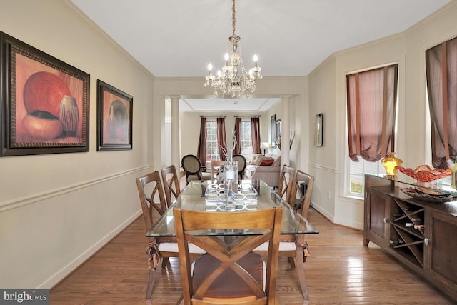 13110 Ogles Hope Dr, Bowie, MD 20720 - dining room featuring ornate columns, crown molding, and wood finished floors