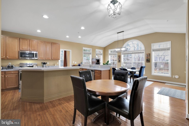 13110 Ogles Hope Dr, Bowie, MD 20720 - dining area featuring baseboards, lofted ceiling, light wood-style flooring, an inviting chandelier, and recessed lighting