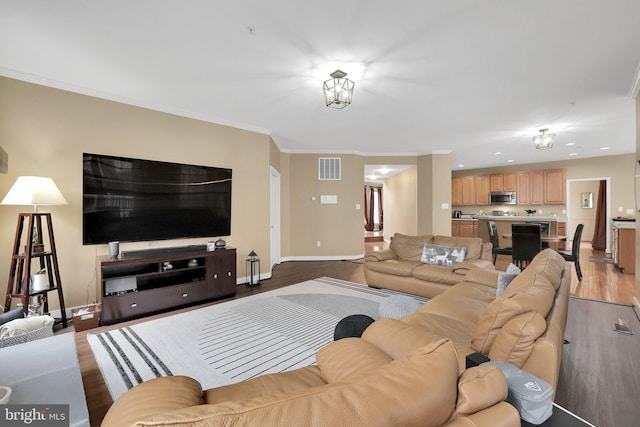 13110 Ogles Hope Dr, Bowie, MD 20720 - living area with crown molding, recessed lighting, visible vents, light wood-style floors, and baseboards