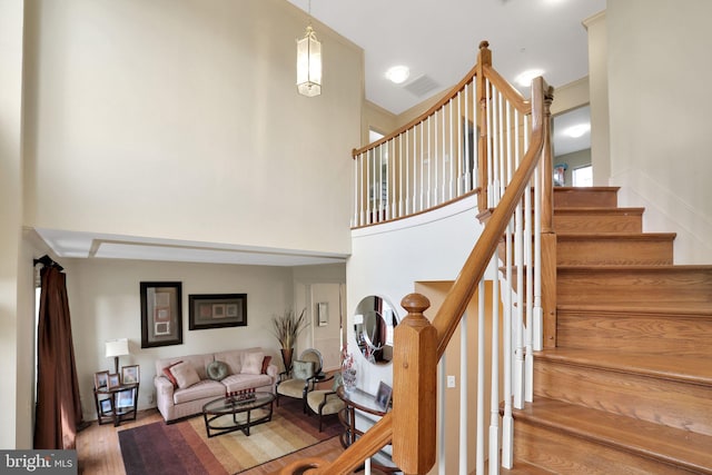 13110 Ogles Hope Dr, Bowie, MD 20720 - stairs featuring a high ceiling and wood finished floors