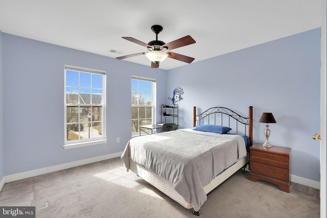 13110 Ogles Hope Dr, Bowie, MD 20720 - bedroom featuring light carpet, visible vents, baseboards, and ceiling fan