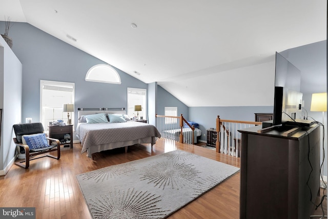 13110 Ogles Hope Dr, Bowie, MD 20720 - bedroom with light wood-type flooring, visible vents, and vaulted ceiling