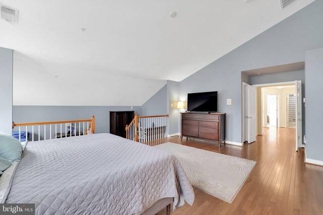 13110 Ogles Hope Dr, Bowie, MD 20720 - bedroom with baseboards, vaulted ceiling, visible vents, and dark wood finished floors