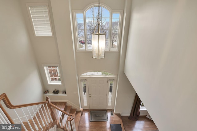 13110 Ogles Hope Dr, Bowie, MD 20720 - entrance foyer with a notable chandelier, a high ceiling, baseboards, stairway, and dark wood finished floors