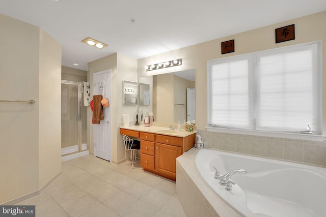 13110 Ogles Hope Dr, Bowie, MD 20720 - bathroom with a garden tub, a stall shower, vanity, tile patterned flooring, and baseboards
