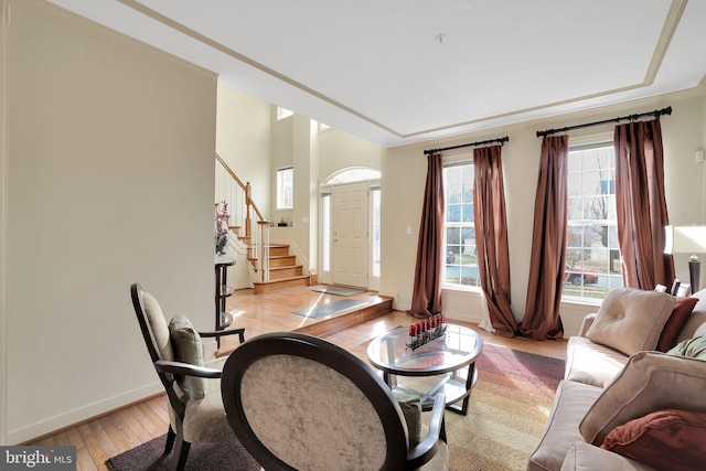 13110 Ogles Hope Dr, Bowie, MD 20720 - living area featuring crown molding, light wood finished floors, stairway, and baseboards