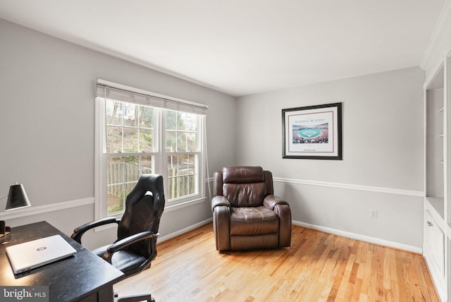 office area featuring baseboards and wood finished floors