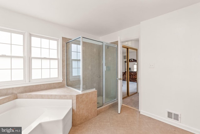 bathroom featuring a garden tub, a stall shower, tile patterned flooring, and visible vents