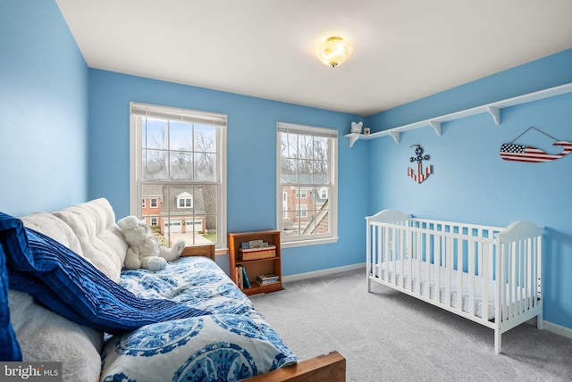 carpeted bedroom with baseboards