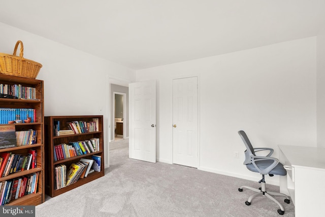 home office featuring carpet and baseboards