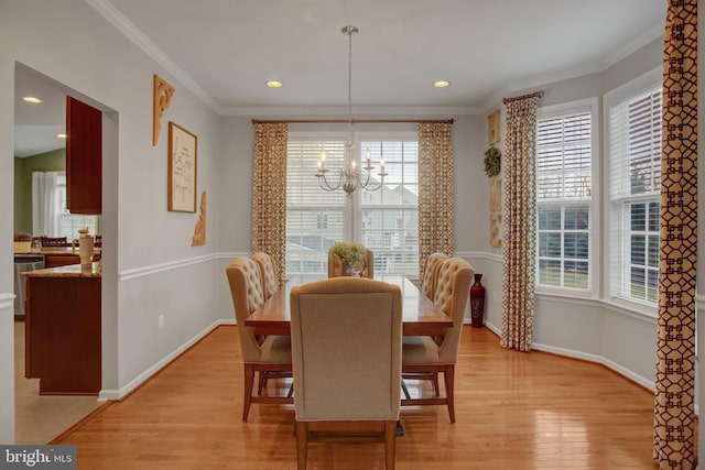 dining room with crown molding, a notable chandelier, recessed lighting, light wood-style flooring, and baseboards