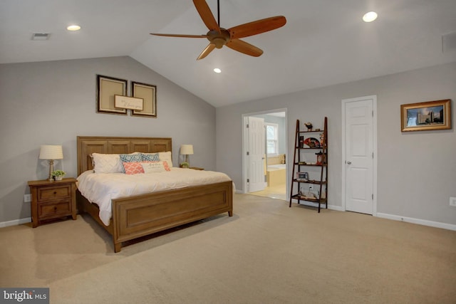 bedroom featuring lofted ceiling, connected bathroom, light colored carpet, visible vents, and baseboards