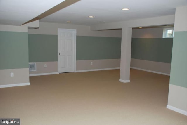 basement featuring carpet floors, recessed lighting, visible vents, and baseboards