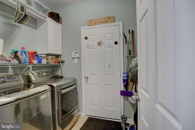 laundry area with cabinet space and independent washer and dryer