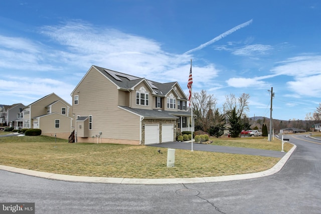 view of home's exterior with a yard, solar panels, an attached garage, a residential view, and driveway