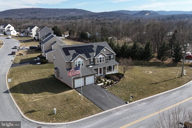 aerial view featuring a mountain view and a wooded view