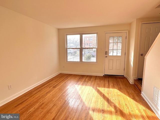 entryway featuring light wood-style flooring and baseboards