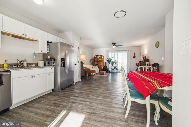 interior space featuring a ceiling fan and wood finished floors