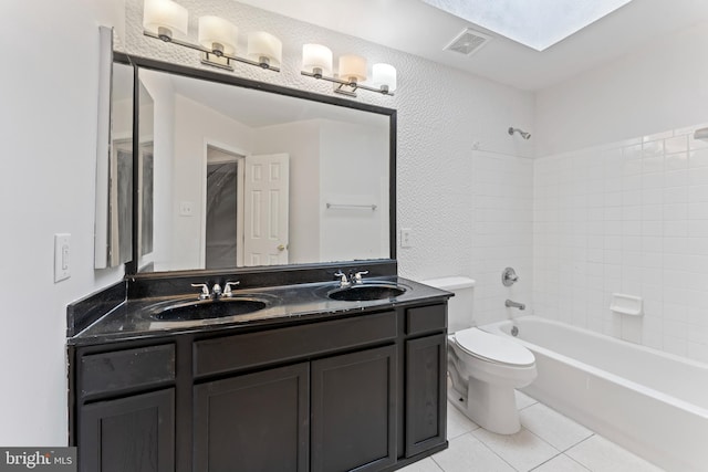 full bathroom featuring tile patterned floors, visible vents, toilet, and a sink