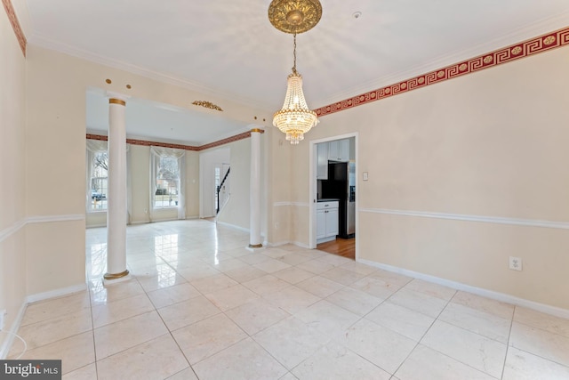 spare room featuring stairs, baseboards, crown molding, and ornate columns