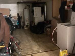 below grade area with gas water heater and washer / dryer
